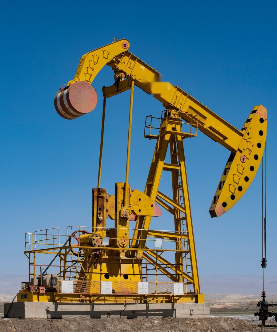 Pumpjack on a South Texas oil lease against a clear blue sky — the kind of oilfield site SCI Electrical wires, powers, and protects