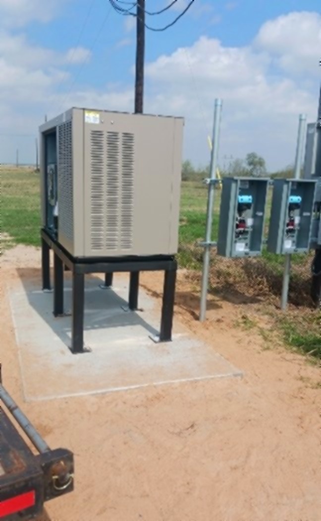 SCI Electrical standby generator installed on a concrete pad with disconnects in a South Texas oilfield